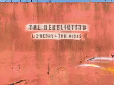 A rust red concrete slab wall with words "The Dereliction" written in stencil font.