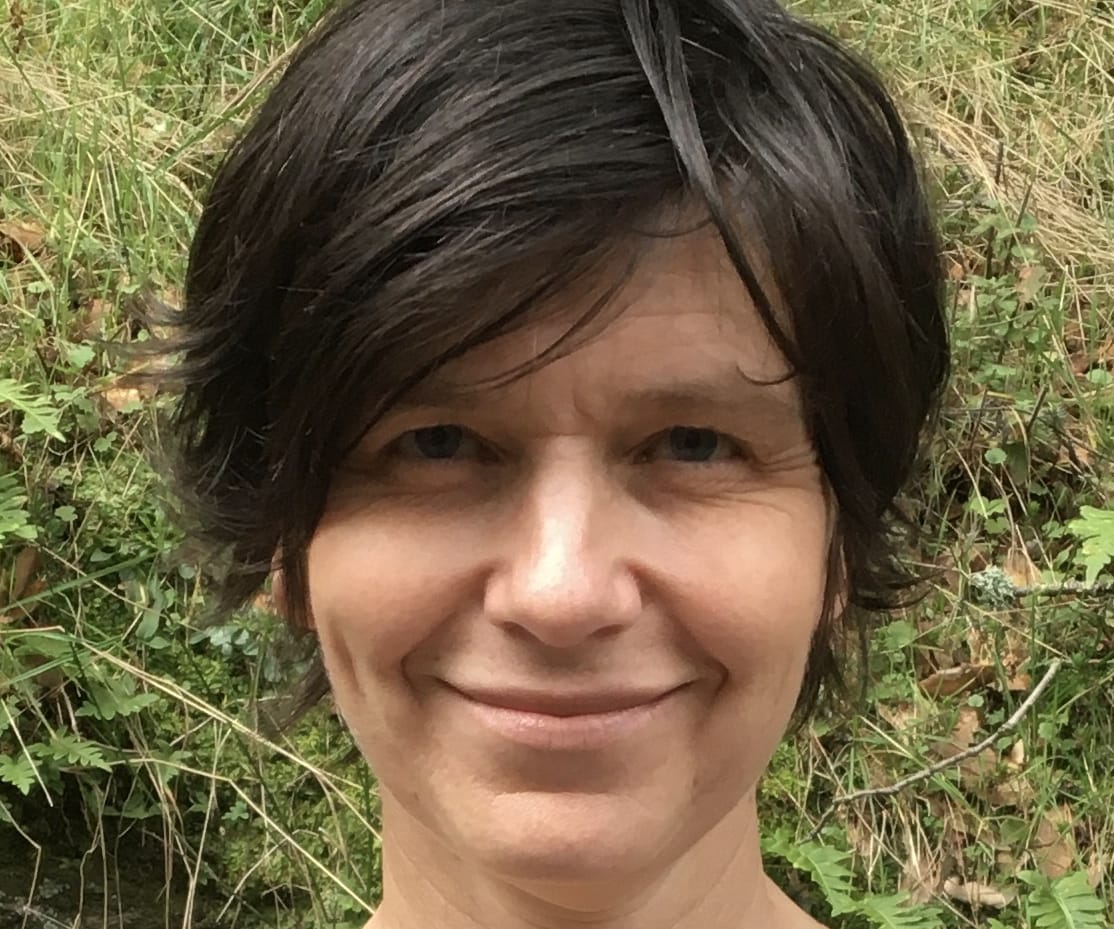 photo of Sharon, she has dark hair and is smiling