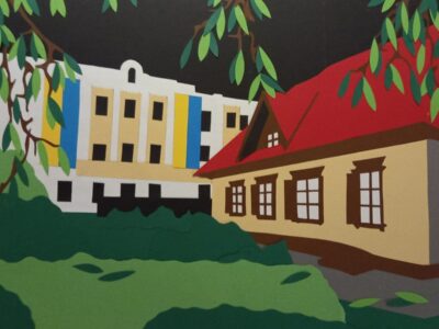 A paper cut out of Taras Shevchenko's house. the roof is red and there is a dormer window in the roof , it looks traditional, there is a more modern building in the background and grass in the foreground