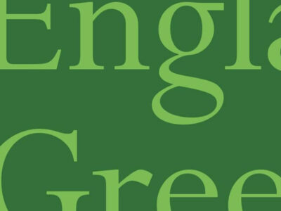 Partial text of the words 'England's Green'. The text is light green serif font on a dark green background. That's imaginative.