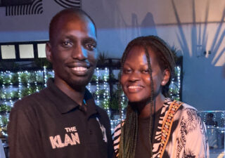 A photograph of Mercy and Jordan in Kampala. They are smiling.
