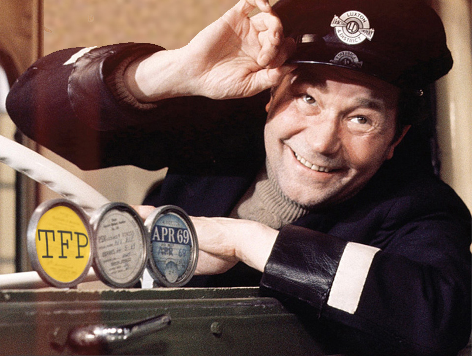 A photograph showing Reg Varney sitting in his London bus.If you're old enough you'll remember 'On the buses'. "That's made my day that has, that's really made my day."