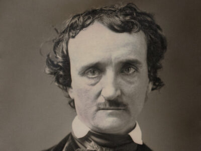 Black and white photograph of Edgar Allan Poe. He looks intently at the camera.