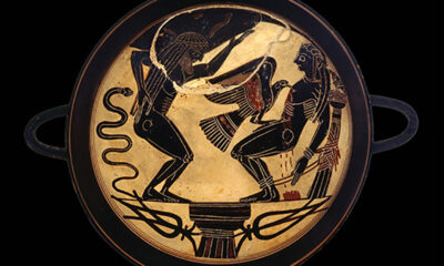 What looks like an ancient Greek plate or bowl. A bloke with a bad back seems to be have been bitten by a snake and he is gesticulating towards a reclining fellow who is possibly having his heart pecked out by a large bird of prey. Lotta blood, but they were rough in them days.
