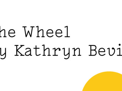 Black text on white reads: ‘The Wheel by Kathryn Bevis' with half a a small yellow Friday Poem blob setting over the bottom right hand edge.