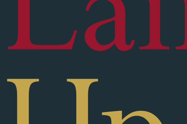 Pieces of text in red and gold on a dark blue book cover.