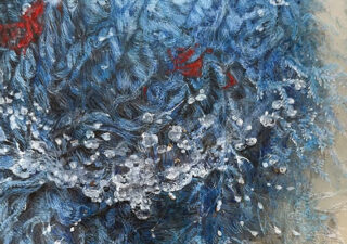 I think it's wool. Mostly blue but with th occasional red splurge. Oh, and there are some, drops of water that look frozen.