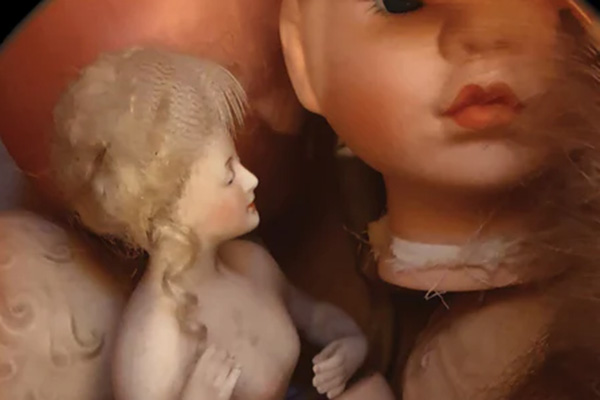 Photo showing a jumble of children's plastic dolls in a state of disrepair.