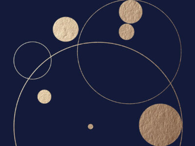 A blue background with some gold solid circles and some gold circle outlines. They look a little like planets.
