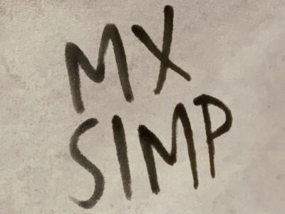 The words MX Simp on a beige background.