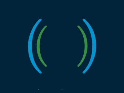 Dark navy blue background with semi-circular lines in green and blue. They look a bit like the lines you draw around a radio tower or loudspeaker, to indicate vibration or noise.