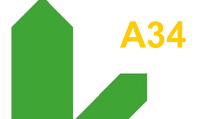 Two green arrows show road directions and the letters A34 are shown in yellow.