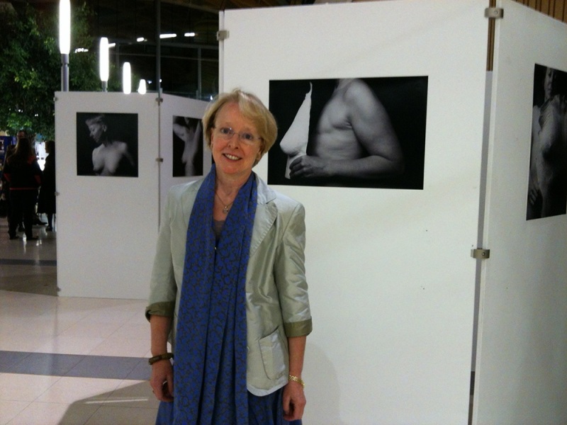 Clare Best with some of Laura Stevens’ photographs of her, on display at the University of Exeter, 2012