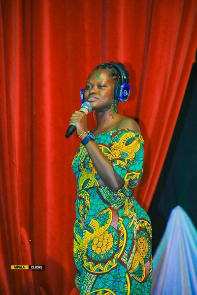 Mercy performing at a comedy platform called The Comedy Black Friday at Theatre LaBonita in Uganda